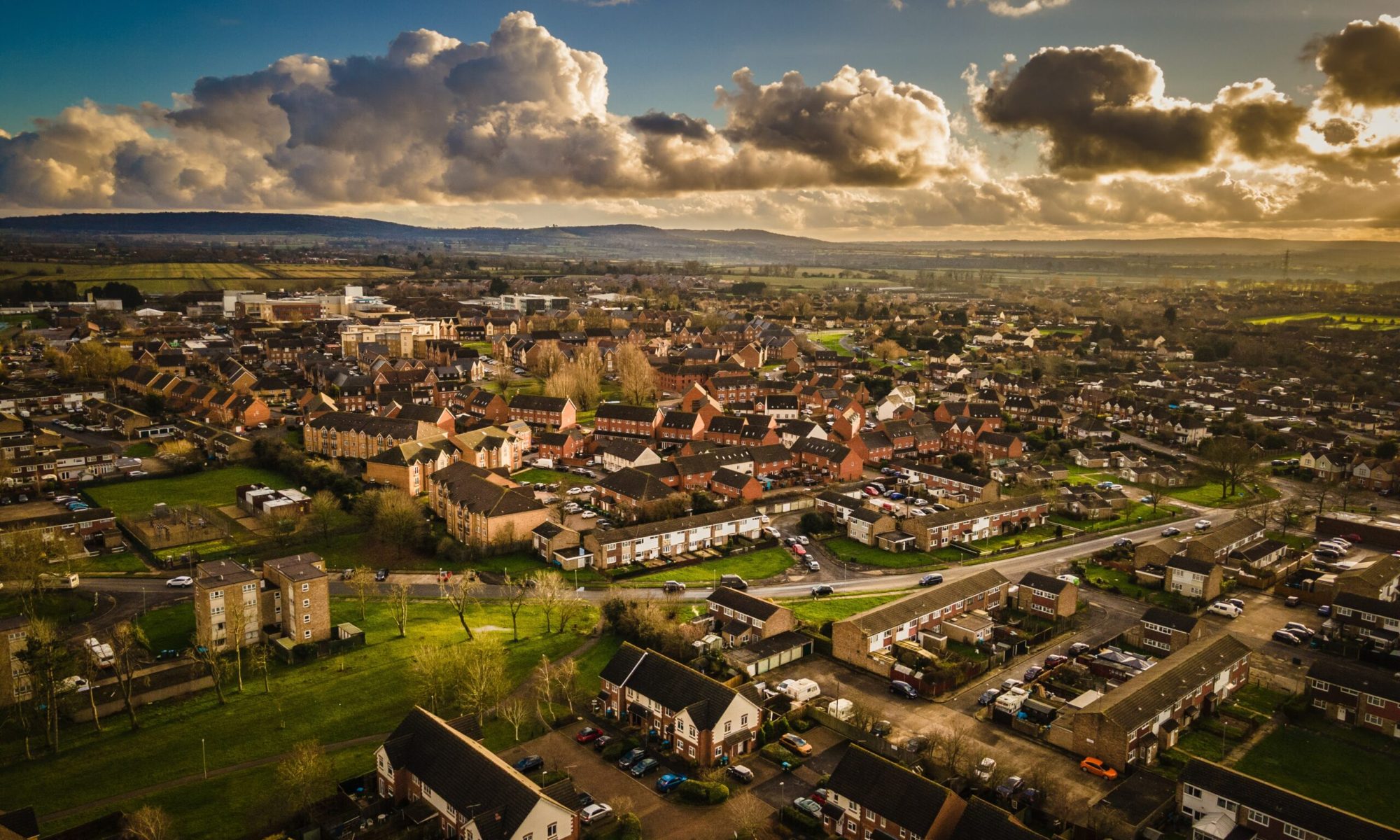Aerial drone shot of the south side of Aylesbury, Buckinghamshire, with the Chiltern hills in the background.